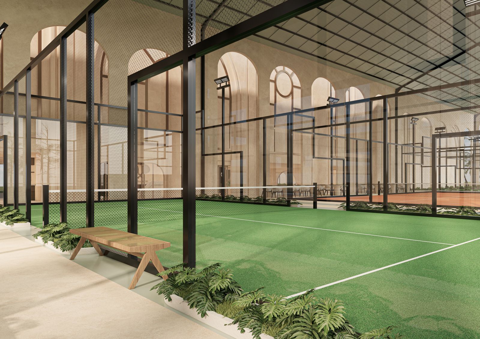 Court en gazon et banc en rotin sous les arcades
